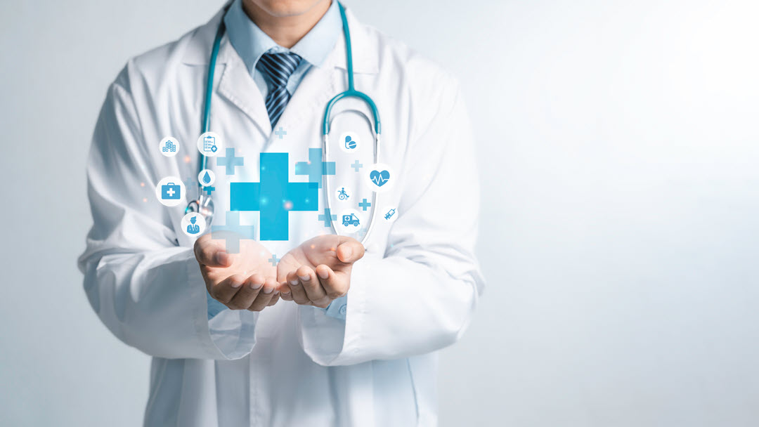 provider holding hologram of medical symbols